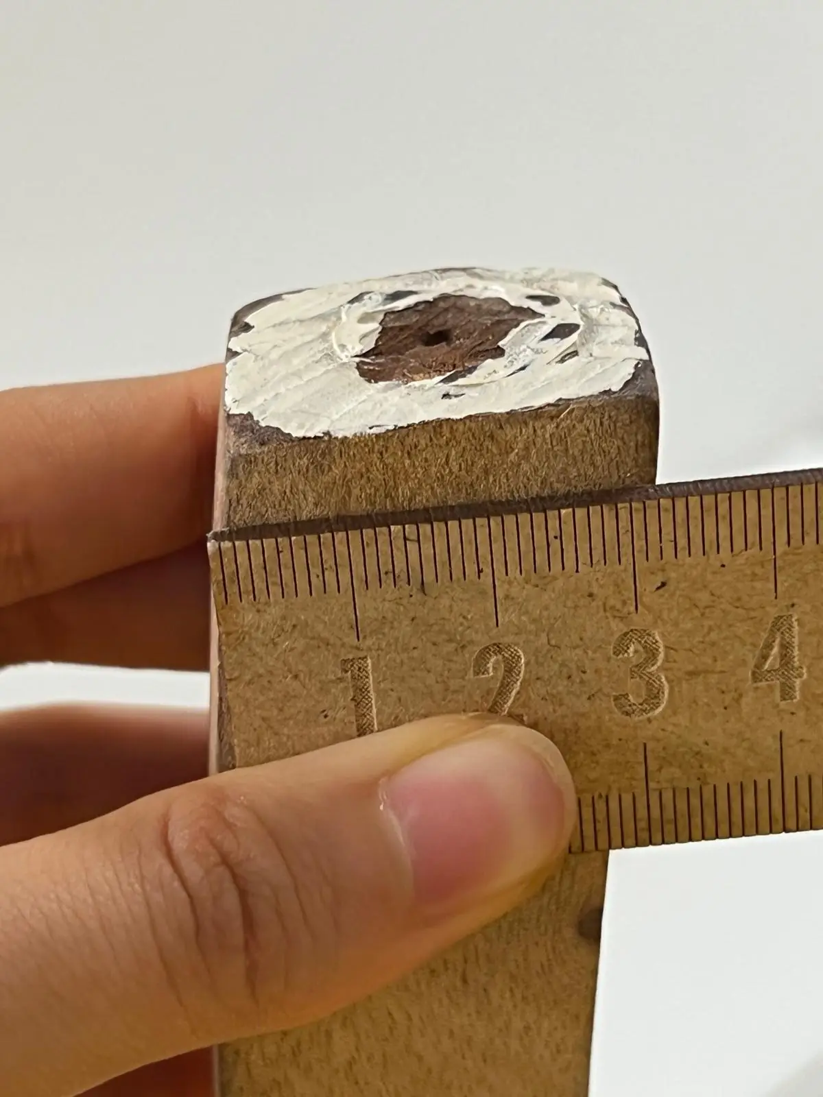Salvaged curved timber, a bored four-centimetre section against a ruler, the 3D-printed base seating the stem, and assembly